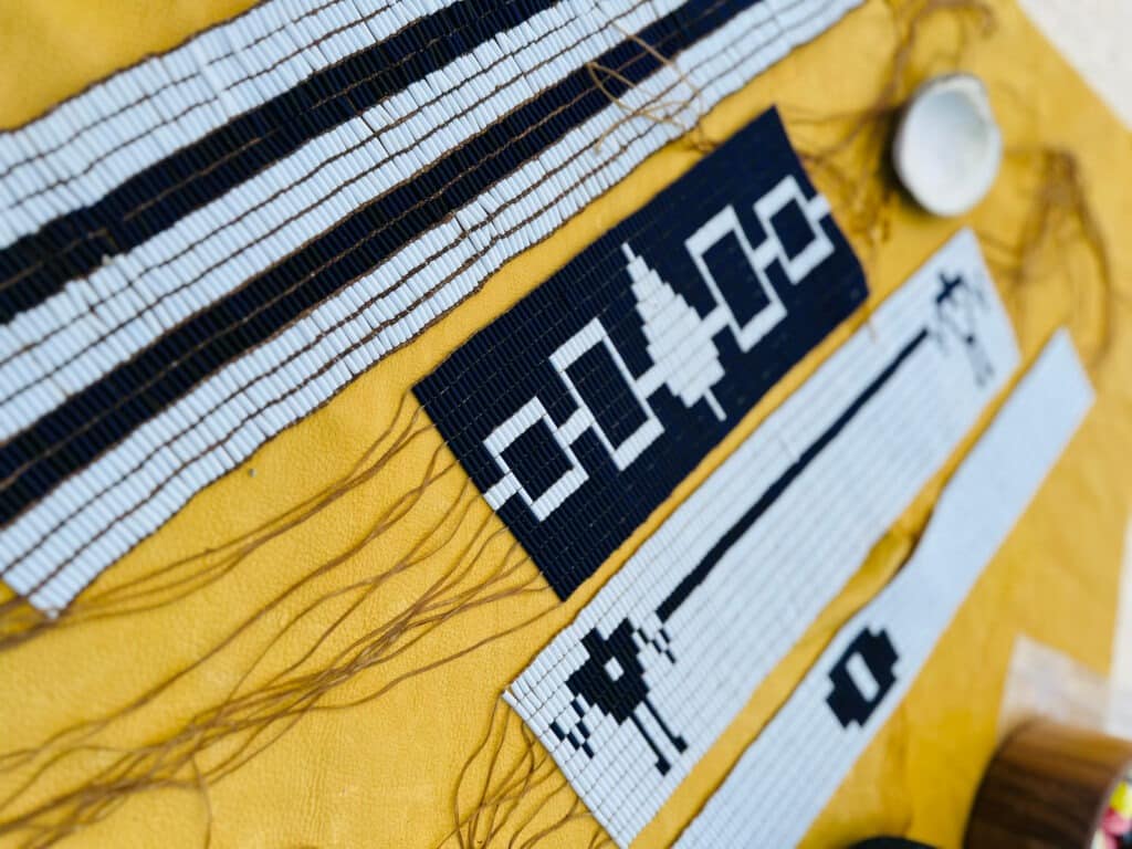 White and blue Wampum belts on a tanned background